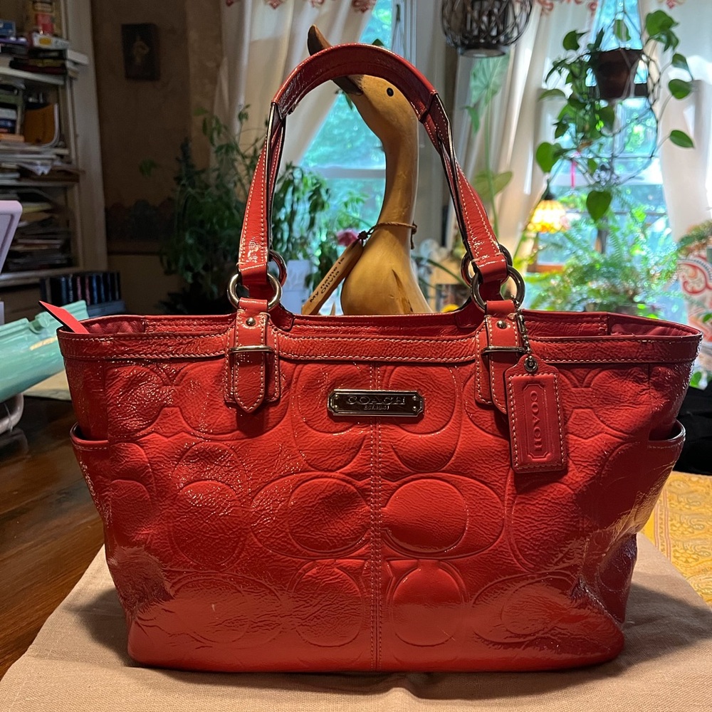 Coach crimson or dark pink
